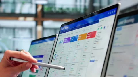 Sales Manager Reviewing Customer Data On Laptop Video stock 337641627