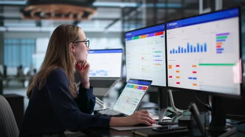 Sales Manager Reviewing Customer Data Using Laptop Stock Footage 339895170