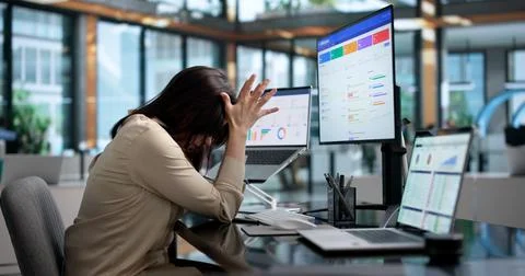 Sales Manager Using Computer Feels Tired And Stressed With Sales Tools. Stock Photos
