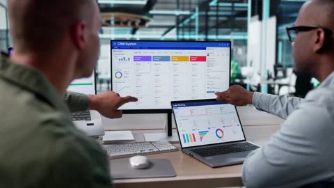 Sales Managers Discuss Customer Relationship Management Software Stock Footage 335878630