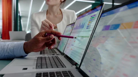 Sales Managers Discussing Customer Data On Laptop Stock Footage 342976469