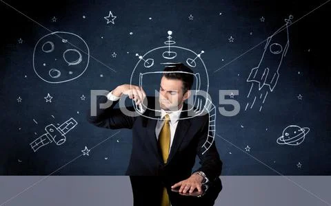 Sales person drawing helmet and space rocket Stock Photos