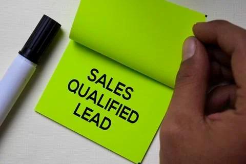 Sales Qualified Lead - SQL text on sticky notes isolated on office desk Stock Photos