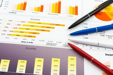 Sales Report in Statistics Graphs and several color pencil's Stock Photos