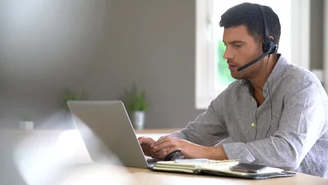 Sales representative working from home on laptop computer Stock Footage 69853860