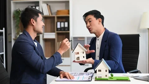 Salesman Hands On House Model , Small Toy House Small Mortgage Property ins.. Video stock 312980805