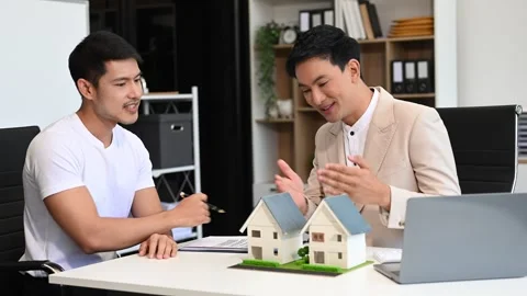 Salesman Hands On House Model , Small Toy House Small Mortgage Property ins.. Stock Footage 312980826