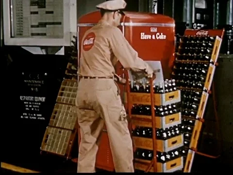 Salesman restocking soda machine, testing soda temperature with thermometer-1950 Stock Footage 107364195
