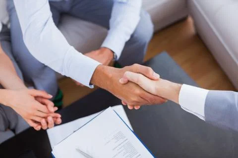 Salesman shaking hands with client Stock Photos