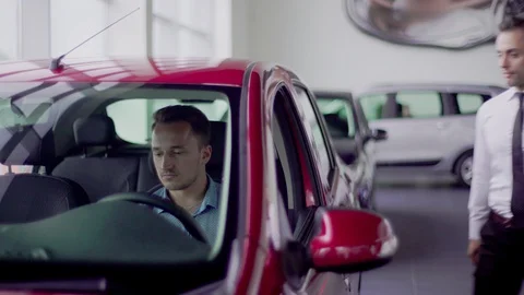 Salesman shows the car features for client. Stock Footage 92662843