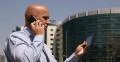 Salesman Smartphone Business Discussion Browsing Internet Tablet City Center Day 4k or 4k+ Resolution