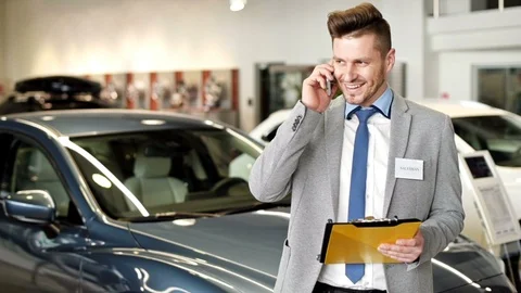 Salesman talking on mobile phone Stock-Footage 86728997