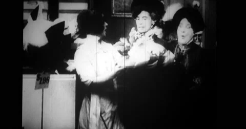 Saleswoman showing hat to customers Stock Footage