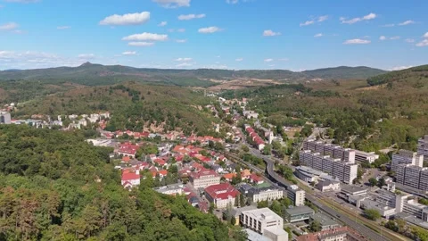 Salgótarján cityscape with panel buildings in a green valley by hills Vídeos de archivo 346152351