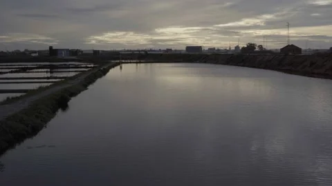 Salinas de Aveiro with Cloudy Sunset Stock Footage 237876661
