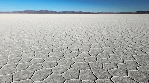 Salinas Grandes Salt Flat Hexagonal Patterns and Distant Mountains in Jujuy Stock Footage 346850330