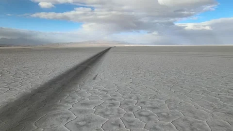 Salinas Grandes Salt Flat Tire Tracks Vanishing Toward Distant Horizon in Jujuy Stock Footage 346192034