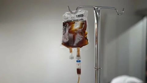 The Saline Drops From The Bottle Flowing Through The Hose. Slow Motion 4K Stock Footage 180299871