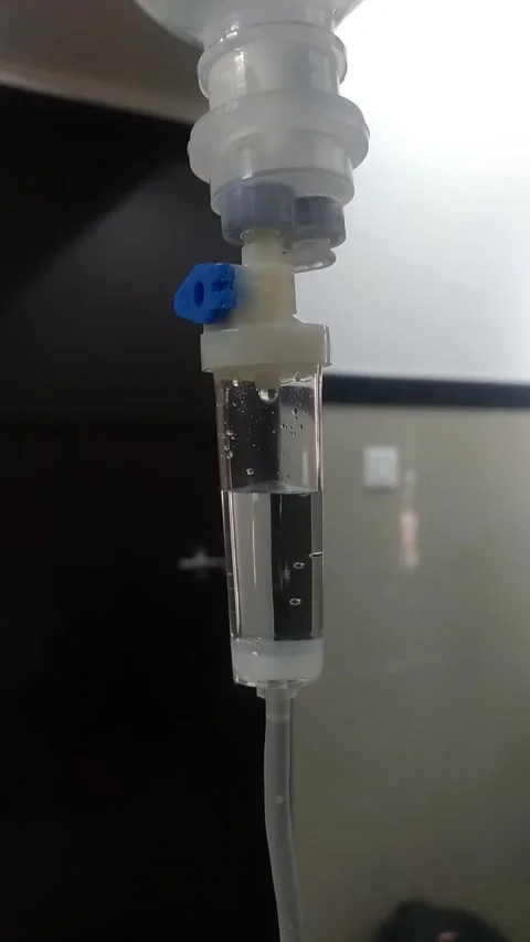 Saline drops dripping in an IV drip Stock Footage 138315214