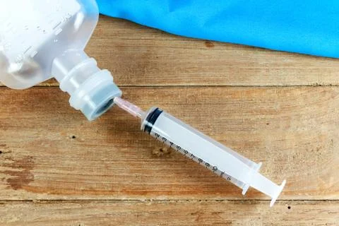 Saline solution and injection needle Stock Photos