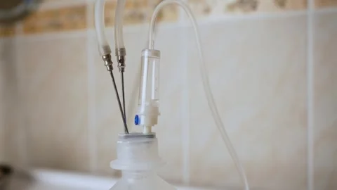 Saline solution in a drip at the hospital. Video stock 258276903