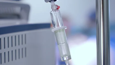 Saline solution drips in the drop counter. Close up. Medical equipment concept. Stock Footage 340928989