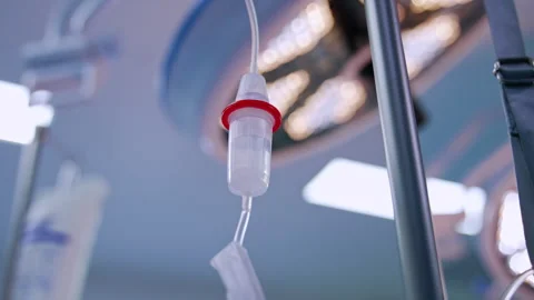 Saline solution filling the drop counter reservoir.  Stock Footage 254832413