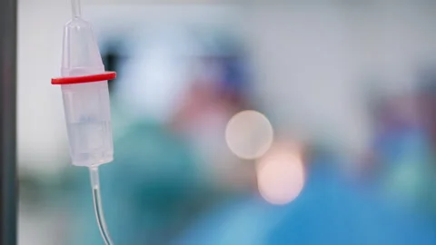 Saline solution in the iv drip. Close up. Stock Footage 255634098