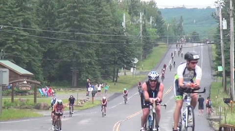 Salmini 10015-081015 - Cyclists down hill to camera Lake Placid Video stock 53230367