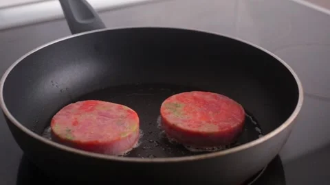 Salmon and broccoli steak fried in a pan. fish steak close up. cooking dinner at Stock Footage 169258019