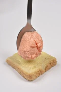 Salmon and fish roe spread on a spoon over bread Stock Photos