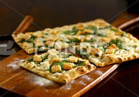 Salmon and spinach pizza Stock Photos