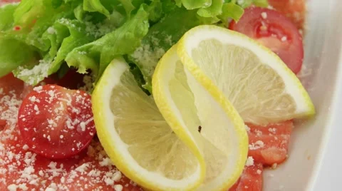Salmon carpaccio with lemon (loop) Stock Footage 58000825