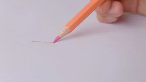 The salmon-colored pencil is broken when it uses for drawing  Stock Footage 150666083