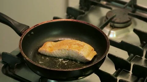 Salmon cooking in frying pan Stock-Footage 75216596