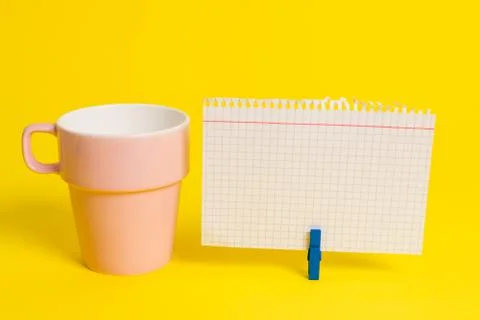 Salmon cup and a empty note paper pinned in a blue clothespin. Square rectangle Stock Photos