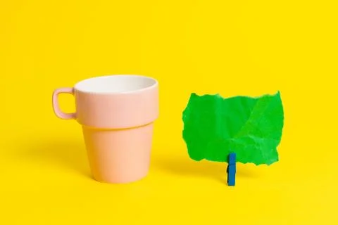 Salmon cup and a empty note paper pinned in a blue clothespin. Square rectangle Stock Photos