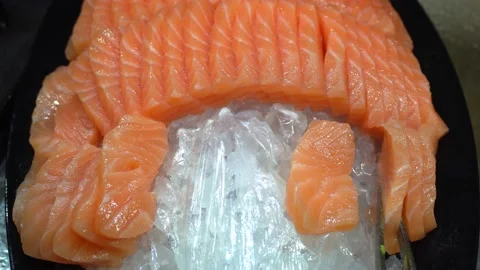 Salmon cut in slices on ice Stock Footage 224315868
