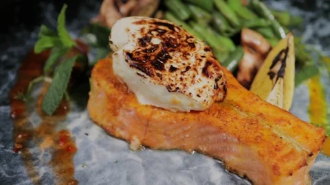 Salmon dish with vegetables on a plate Stock Footage 328424671