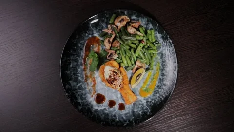 Salmon dish with vegetables on a plate Stock Footage 328424672