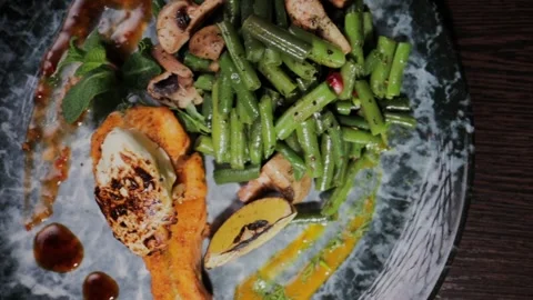 Salmon dish with vegetables on a plate Video stock 328424688