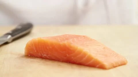 Salmon fillet being sliced Stock Footage 24652337