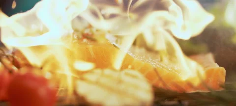 Salmon fillet falling on fire flame Stock Footage 311833744