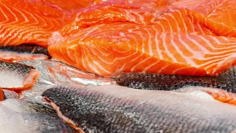 Salmon fillet raw cut into chunks, moving sideways Stock-Footage 243991229