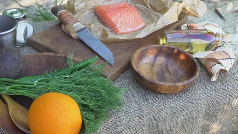 Salmon fillet on the table with cooking utensils. Stock Footage