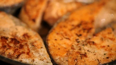 Salmon fried in a pan Stock Footage 99791261