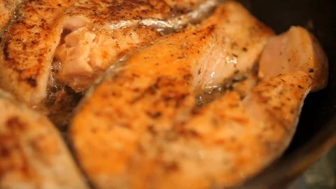 Salmon fried in a pan Stock Footage 99791999