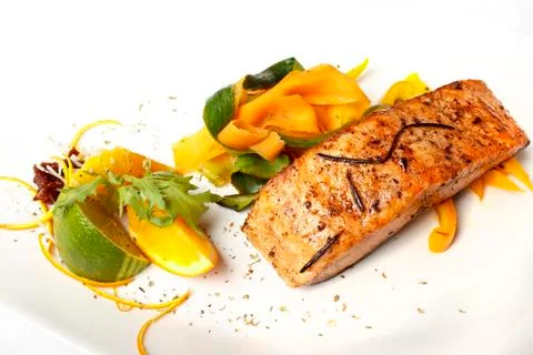 Salmon on grate with lime Stock Photos