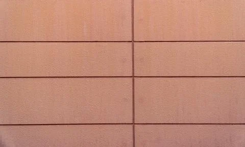 Salmon Pink Concrete Panel Wall with Recessed Joint Lines Fotos Stock