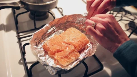 Salmon in the process of preparation for cooking Stock Footage 233210449